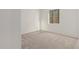 Empty bedroom with plush carpet and a single window at 21726 E Lords Way, Queen Creek, AZ 85142