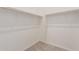 Walk-in closet offering plenty of hanging space and shelving in a pristine white finish at 21726 E Lords Way, Queen Creek, AZ 85142