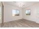 Dining area with large windows and wood-look flooring at 21726 E Lords Way, Queen Creek, AZ 85142