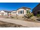 Front exterior of a single-story home with a two-car garage at 21726 E Lords Way, Queen Creek, AZ 85142