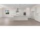 Bright, open kitchen with white cabinetry, an island, and stainless steel appliances at 21726 E Lords Way, Queen Creek, AZ 85142