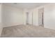 Spacious main bedroom with neutral carpet and ensuite bathroom access at 21726 E Lords Way, Queen Creek, AZ 85142