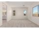 Main bedroom with ensuite bathroom access and plush carpet at 21726 E Lords Way, Queen Creek, AZ 85142