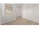 Empty home office with wood-look flooring and a large window at 21726 E Lords Way, Queen Creek, AZ 85142