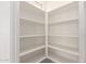 Large walk-in pantry with ample shelving for storage at 21726 E Lords Way, Queen Creek, AZ 85142