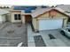 House front with solar panels, double garage, and basketball hoop at 11322 W Diana Ave, Peoria, AZ 85345
