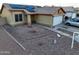 House front with solar panels, double garage, and landscaped yard at 11322 W Diana Ave, Peoria, AZ 85345