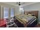 Bedroom with king-size bed and access to a patio at 11322 W Diana Ave, Peoria, AZ 85345