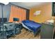 Bedroom with a bed, desk and floor-length curtains at 11322 W Diana Ave, Peoria, AZ 85345