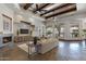 Bright living room with stone fireplace and built-in entertainment center, offering ample natural light at 4327 E Capricorn Pl, Chandler, AZ 85249