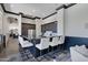 Modern kitchen with dark cabinetry and a breakfast bar at 4327 E Capricorn Pl, Chandler, AZ 85249