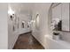 Long hallway with arched niches and artwork at 4327 E Capricorn Pl, Chandler, AZ 85249