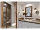 Elegant bathroom with a walk-in shower, white cabinets, and stone countertops at 4327 E Capricorn Pl, Chandler, AZ 85249