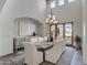 Elegant dining room with a large table and chandelier, offering access to outdoor patio at 4327 E Capricorn Pl, Chandler, AZ 85249
