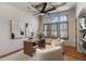 Bright home office with hardwood floors and built-in shelving at 4327 E Capricorn Pl, Chandler, AZ 85249