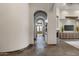 Elegant hallway with arched entryways and tile flooring at 4327 E Capricorn Pl, Chandler, AZ 85249