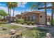 House exterior showcasing stone facade and lush landscaping at 4327 E Capricorn Pl, Chandler, AZ 85249