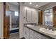 Double vanity bathroom with stone countertops at 4327 E Capricorn Pl, Chandler, AZ 85249