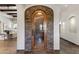 Custom wine cellar with stone exterior and wood shelving at 4327 E Capricorn Pl, Chandler, AZ 85249