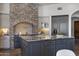 Modern kitchen with large island and stone accents at 4327 E Capricorn Pl, Chandler, AZ 85249