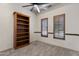 Bright bedroom with built-in shelves and plantation shutters at 4327 E Capricorn Pl, Chandler, AZ 85249