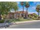 Elegant stone house with palm trees and manicured lawn at 4327 E Capricorn Pl, Chandler, AZ 85249