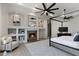 Bright bedroom featuring a cozy fireplace, built-in shelving, and a comfortable sitting area at 4327 E Capricorn Pl, Chandler, AZ 85249