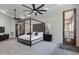 Spacious primary bedroom with a large four-poster bed, and private access to an outdoor patio at 4327 E Capricorn Pl, Chandler, AZ 85249