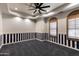 Nautical-themed bedroom with striped wall and ceiling fan at 4327 E Capricorn Pl, Chandler, AZ 85249