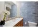 Small bathroom with patterned tile and single sink vanity at 3852 E Expedition Way, Phoenix, AZ 85050
