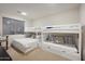 Bedroom with twin-over-full bunk bed and window at 3852 E Expedition Way, Phoenix, AZ 85050