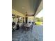 Outdoor patio features a dining table and chairs with views to the backyard at 3852 E Expedition Way, Phoenix, AZ 85050