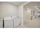 Laundry room with washer, dryer, and access to upstairs hallway at 3852 E Expedition Way, Phoenix, AZ 85050