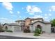 Two story home with landscaping and desert plants at 3852 E Expedition Way, Phoenix, AZ 85050