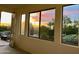 Room with access to a balcony and sunset views at 3852 E Expedition Way, Phoenix, AZ 85050