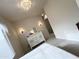 Bedroom with dresser, window and en-suite bath at 3852 E Expedition Way, Phoenix, AZ 85050