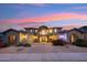 Two story home with landscaping at dusk at 3852 E Expedition Way, Phoenix, AZ 85050