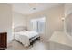 Charming bedroom with a comfortable bed and window seat at 3852 E Expedition Way, Phoenix, AZ 85050