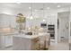 Elegant kitchen features white cabinets, marble countertops, and gold accents at 3852 E Expedition Way, Phoenix, AZ 85050