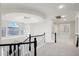 Upper hallway with arched window and modern chandelier at 3852 E Expedition Way, Phoenix, AZ 85050