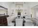 Bright dining room with a large table, chandelier, and hardwood floors at 3852 E Expedition Way, Phoenix, AZ 85050