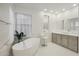 Elegant bathroom with freestanding tub and double vanity at 3852 E Expedition Way, Phoenix, AZ 85050