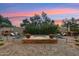 Backyard oasis with a sparkling pool and fire pit at 3852 E Expedition Way, Phoenix, AZ 85050