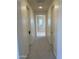 Hallway leading to a bathroom with a window at 3852 E Expedition Way, Phoenix, AZ 85050