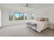 Bright bedroom with large windows and ceiling fan at 3852 E Expedition Way, Phoenix, AZ 85050