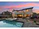 Luxury two-story home with a large backyard, pool, and beautiful sunset views at 3852 E Expedition Way, Phoenix, AZ 85050