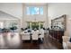 Formal dining room with a large table, chandelier, and hardwood floors at 3852 E Expedition Way, Phoenix, AZ 85050