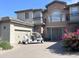 Two story home with golf cart in driveway at 3852 E Expedition Way, Phoenix, AZ 85050