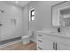 Modern bathroom with white vanity, walk-in shower, and wood-look floors at 26761 S 181St Pl, Queen Creek, AZ 85142