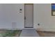 Modern exterior door with sleek handle and light fixture at 26761 S 181St Pl, Queen Creek, AZ 85142